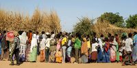 Ethiopian refugees from Tigray region wait in line to receive aid at the Um Rakuba refugee camp. (Photo: EPA-EFE / Ala Kheir)
