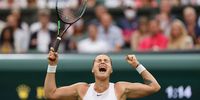 LONDON, ENGLAND - JULY 06: Aryna Sabalenka of Belarus celebrates match point in her Ladies' Singles Quarter-Final match against Ons Jabeur of Tunisia during Day Eight of The Championships - Wimbledon 2021 at All England Lawn Tennis and Croquet Club on July 06, 2021 in London, England. (Photo by Clive Brunskill/Getty Images)