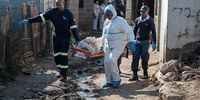 Forensic investigators remove the bodies of victims following the Cleveland, Johannesburg, mass shooting in which 12 people were killed.