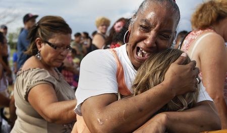 Colorado town, Obama honour shooting victims