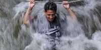 epaselect epa12152306 An image made with a slow shutter speed shows a man holding onto a rope amid strong river currents while trying to cool off in Tanjung Malim, state of Perak, Malaysia, 03 June 2025. Earlier in May 2025, Malaysian Meteorological Department director-general Dr. Mohd Hisham Mohd Anip said, 'The Southwest Monsoon is expected to begin on May 10 and continue until September. During the monsoon, lower humidity levels typically lead to reduced rain cloud formation across most areas. As a result, the country will experience reduced rainfall during this period, with more dry days than rainy ones.'  EPA-EFE/FAZRY ISMAIL