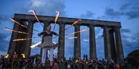 EDINBURGH, SCOTLAND - JUNE 21: Performers from Fire Club Edinburgh mark the summer solstice during a fire festival on Calton Hill on June 21, 2021 in Edinburgh, United Kingdom. The summer solstice is the longest day in the northern hemisphere and has inspired a range of folkloric traditions across Europe. (Photo by Peter Summers/Getty Images)