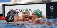 epaselect epa09378100 Tatjana Schoenmaker of South Africa (2-R)  reacts after her World Record time in the Women's 200m Breastroke Final as she is  congratulated by Lilly King of the U.S. (L), Annie Lazor of the U.S. (2-L), and Kaylene Corbett of South Africa (R) during the Swimming events of the Tokyo 2020 Olympic Games at the Tokyo Aquatics Centre in Tokyo, Japan, 30 July 2021.  EPA-EFE/HOW HWEE YOUNG