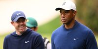 Rory McIlroy of Northern Ireland and Tiger Woods of the United States walk to the 14th tee during a practice round prior to the 2023 Masters Tournament at Augusta National Golf Club on April 03, 2023 in Augusta, Georgia. (Photo by Ross Kinnaird/Getty Images)