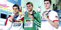Silver medalist Evgeny Rylov of Russia (L) Gold medalist Zane Waddell of South Africa (C) and Bronze medalist Kliment Kolesnikov of Russia (R) pose for photographs during the award ceremony for the men's Backstroke final at the FINA Swimming World Championships 2019 in Gwangju, South Korea, 28 July 2019.  EPA/JEON HEON-KYUN