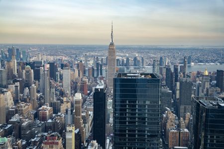 Russian daredevils unfurl banner atop New York’s Empire State Building in proposal stunt