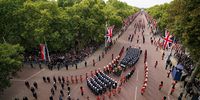 The State Gun Carriage carries the coffin of Queen Elizabeth II, draped in the Royal Standard with the Imperial State Crown and the Sovereign's orb and sceptre, in the Ceremonial Procession down The Mall following her State Funeral at Westminster Abbey on September 19, 2022 in London, England.  Elizabeth Alexandra Mary Windsor was born in Bruton Street, Mayfair, London on 21 April 1926. She married Prince Philip in 1947 and ascended the throne of the United Kingdom and Commonwealth on 6 February 1952 after the death of her Father, King George VI. Queen Elizabeth II died at Balmoral Castle in Scotland on September 8, 2022, and is succeeded by her eldest son, King Charles III. (Photo: Zac Goodwin - WPA Pool / Getty Images)