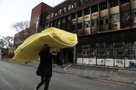 Some Johannesburg inferno survivors refuse shelter, opt to sleep outside fire-ravaged building