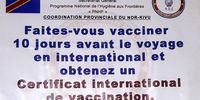 An awareness poster displayed at the Programme National d’Hygiène aux Frontières (PNHF) office in Butembo, Democratic Republic of Congo on 19 August 2025. The poster indicates the official cost of an international vaccination certificate. Despite this travelers frequently report being overcharged for the card in order to obtain it without vaccination at border posts and in PNHF offices. (Photo: Jérémie Kyaswekera  / SA | AJP)