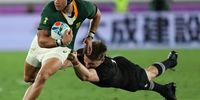 Cheslin Kolbe of South Africa gets past the tackle of Beauden Barrett of New Zealand during the Rugby World Cup 2019 Group B match at International Stadium Yokohama on 21 September 2019 in Yokohama, Kanagawa, Japan. (Photo: Mike Hewitt / Getty Images)