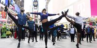 epa09070257 Broadway dancers and actors perform during a pop-up performance in Times Square called 'We Will Be Back' which was organized by the theater community to commemorate a year since theaters on Broadway were shut down due to the coronavirus pandemic in New York, New York, USA, 12 March 2021. Broadway shows, and other live entertainment venues, are hoping to reopen later in the year but there are still questions about the financial viability of many shows if seating capacity continues to be limited by worried over the spread of COVID-19.  EPA-EFE/JUSTIN LANE