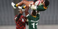 TOKYO, JAPAN - JULY 26: Kurt-Lee Arendse of South Africa is lifted high into the air by Siviwe Soyizwapi, captain of South Africa, during the Rugby Sevens match between South Africa and Kenya on Day 3 of the Tokyo 2020 Olympic Games at Tokyo Stadium on July 26, 2021 in Tokyo, Japan. (Photo by Roger Sedres/Gallo Images/Getty Images)