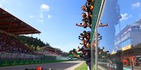 SPA, BELGIUM - AUGUST 28: Race winner Max Verstappen of the Netherlands driving the (1) Oracle Red Bull Racing RB18 passes his team celebrating on the pitwall during the F1 Grand Prix of Belgium at Circuit de Spa-Francorchamps on August 28, 2022 in Spa, Belgium. (Photo by Mark Thompson/Getty Images)