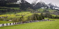 The pack of riders in action during the first stage, a 165,7 km race between Chateau-d'Oex and Fribourg, of the 77th Tour de Romandie UCI World Tour Cycling race, in Chateau-d'Oex, Switzerland, 24 April 2024.  EPA-EFE/JEAN-CHRISTOPHE BOTT