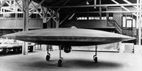 A 3/5 scale model of a proposed VTOL 'flying saucer' aircraft, the Couzinet Aerodyne RC-360, on display at a workshop on the Ile de la Jatte in Levallois-Perret, Paris, 1955. Designed by French aeronautical engineer Rene Couzinet (1904 - 1956), the Aerodyne was to feature two contra-rotating crowns of 96 small wings rotating around a motionless cockpit. These were to be powered by six 180 HP Lycoming engines in three pairs. Horizontal propulsion was to be provided by the jet engine, which can be seen mounted under the cockpit. The aircraft was refused government backing, however, and never reached the prototype stage. (Photo by Keystone/Hulton Archive/Getty Images)