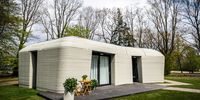 epa09169677 A view of the first house made of 3D printed concrete in Eindhoven, Netherlands, 30 April 2021. The rental house is the first of five from Project Milestone. According to the builders, printed houses can be built a lot faster and are more sustainable.  EPA-EFE/ROB ENGELAAR