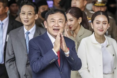 Thai parliament to vote on new PM, as Thaksin jets off amid chaos