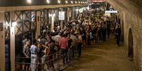 LONDON, ENGLAND - JULY 24: Club-goers queue to get in to Heaven nightclub on July 24, 2021 in London, England. On Monday, July 19th the remaining Coronavirus lockdown measures across England were lifted. Nightclubs and Theatres reopened and general mask-wearing rules have been relaxed.  (Photo by Rob Pinney/Getty Images)