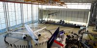 A new Airbus SE A220 narrow-body passenger jet during its unveiling by Air-France-KLM at Paris Charles de Gaulle airport in Paris, France, on Wednesday, Sept. 29, 2021. The A220 aircraft will replace 51 Airbus A318s and A319s with an average age close to 17 years that operate a significant chunk of Air Frances intra-European operations. Photographer: Nathan Laine/Bloomberg via Getty Images
