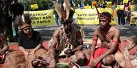 West Papuan indigenous activists take part in a rally against palm oil expansion that threatens their forest in front of the Supreme Court building in Jakarta, Indonesia, 27 May 2024. Dozens of the Awyu and Moi Indigenous Peoples from West Papua and environment activists staged a rally urging the Supreme Court to revoke the permits of two palm oil companies in Boven Digoel and Sorong, which threaten customary forests.  EPA-EFE/ADI WEDA