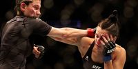 Roxanne Modafferi punches Casey O’Neill of Scotland  in their women’s flyweight fight during UFC 271 at Toyota Center on 12 February 2022 in Houston, Texas. (Photo: Carmen Mandato / Getty Images)