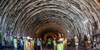ZOJILA, KASHMIR, INDIA - SEPTEMBER 28: Engineers workers and media person inspect the under construction Zojila tunnel which will connect Kashmir with Ladakh union territories, on September 28, 2021 in Baltal 100 km east of Srinagar, Indian administered Kashmir, India. Zojila serves as the only road Link between Kashmir and Ladakh which holds strategic significance as Zojila Pass is situated at an altitude of 11,578 feet on the Srinagar-Kargil-Leh National highway and remains closed during winters due to heavy snowfall, cutting off Ladakh region from Kashmir.  When completed, it will be the longest bidirectional tunnel in Asia. The 14 km long tunnel will reduce the time to cross the ZojiLa from more than 3 hours to just 15 minutes. (Photo by Yawar Nazir/Getty Images)