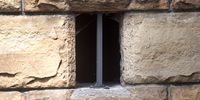 The small barred window near the steps up to St George's Cathedral. (Photo: Brenton Geach)