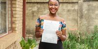 Lerato Mosila holds a copy of her results statement outside her grandmother’s house in Meadowlands, Soweto. (Photo: Sumeya Gasa)