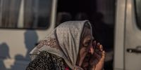 epa09923183 Valentyna (75) reacts after arriving from Mariupol to the evacuation point in Zaporizhzhia, Ukraine, 02 May 2022. On 02 May, thousands of people who were still in Mariupol and other areas in South Ukraine occupied by the Russian army, waited to be evacuated to Ukraine's controlled area by buses and their own cars.  EPA-EFE/ROMAN PILIPEY