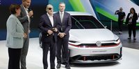 Chairman of the Board of Management of Volkswagen and Porsche AG, Oliver Blume (second-left) stands with German Chancellor Olaf Scholz (third-left) next to a ID GTI Golf e-car during the opening tour at the International Motor Show in Munich, Germany on 5 September, 2023. (Photo: EPA-EFE/Ronald Wittek)