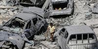 A Palestinian child walks past damaged cars amid the rubble of a destroyed area after Israeli air strikes in Gaza City, on 9 October 2023. The Israeli army announced on 09 October, it carried out over 500 strikes on targets across the Gaza Strip overnight. (Photo: EPA-EFE/Mohsmmed Saber)