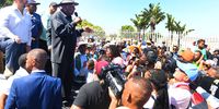 Minister of Police, Bheki Cele addresses the community during his visit to the home of Kelly Smith, the mother of missing Joslin Smith in Diazville on March 02, 2024 in Saldanha, South Africa. The Grade 1 Diazville Primary School learner was last seen on February 19th wearing a light blue T-shirt and light blue denim shorts. (Photo by Gallo Images/Die Burger/Theo Jeptha)