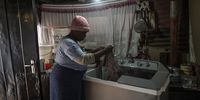 Topsy Radebe as seen doing her washing at her home in Maluti a Phofung, Free State. Radebe says she finds it difficult buying pre paid electricity as she is unemployed.<br>Photo / Shiraaz Mohamed.