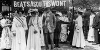 21st June 1908:  One of the seven processions to the 'Monster Meeting' in Hyde Park, led by suffragettes, holding a banner referring to Prime Minister Herbert Asquith.  (Photo by Edward Lloyd/Hulton Archive/Getty Images)