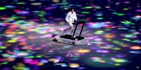 TOKYO, JAPAN - JULY 23: A performer runs on a treadmill during the Opening Ceremony of the Tokyo 2020 Olympic Games at Olympic Stadium on July 23, 2021 in Tokyo, Japan. (Photo by Clive Brunskill/Getty Images)