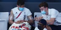 TOKYO, JAPAN - AUGUST 02: Tom Daley of Team Great Britain knits during the Men's 3m Springboard Preliminary Round on day ten of the Tokyo 2020 Olympic Games at Tokyo Aquatics Centre on August 02, 2021 in Tokyo, Japan. (Photo by Clive Rose/Getty Images)
