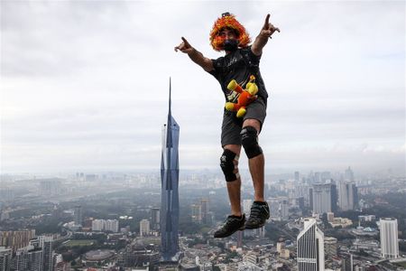 The Day in Pictures: BASE jumps in Kuala Lumpur, and a recent outbreak of avian flu in the UK