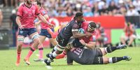 Sharks flank Sikhumbuzo Notshe (left)and prop Carlu Sadie (on the ground) stop Bulls flank Marcell Coetzee in the URC derby at Loftus on Sunday. (Photo by Christiaan Kotze/Gallo Images)