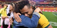 Will Genia of the Wallabies hugs his mother Elizabeth after playing his last game at Suncorp Stadium whre the Wallabies defeated  defeated Argentina in a 2019 Rugby Championship match. (Photo: EPA/DAN PELED)