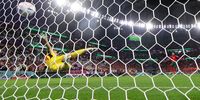 epa10352414 Hakim Ziyech of Morocco converts against goalkeeper Unai Simon of Spain during the penalty shoot-out of the FIFA World Cup 2022 round of 16 soccer match between Morocco and Spain at Education City Stadium in Doha, Qatar, 06 December 2022.  EPA-EFE/TOLGA BOZOGLU