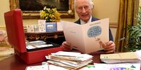  In this photo released on February 23, King Charles III reads cards and messages, sent by well-wishers following his cancer diagnosis, in the 18th Century Room of the Belgian Suite at Buckingham Palace on February 21, 2024 in London, England. Following the announcement of the King's cancer diagnosis, the Correspondence Team at Buckingham Palace have received more than 7,000 letters and cards form across the world. The King has been sent a selection in his daily red box of paperwork. (Photo by Jonathan Brady - Pool/Getty Images)