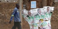 A man walks past election campaign posters of Zimbabwean President Emmerson Mnangagwa in Harare, Zimbabwe, 27 August 2023. Zimbabwe's elections commission said Zanu PF party leader Emmerson Mnangagwa won the election over the Citizens Coalition for Change leader Nelson Chamisa, who has refused to accept the results of the 23 and 24 August 2023 general elections as he said they were not free and fair.  (Photo: EPA-EFE / Aaron Ufumeli) 