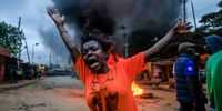 NAIROBI, KENYA - AUGUST 15: Supporters of the Azimio la Umoja-One Kenya coalition barricade roads in Kibera Slum moments after the Indipendent Electoral and Boundaries Commission (IEBC) chairman Mr Wafula chebukati declared Kenya's Deputy Presidents and presidential candidate for the United Democratic Alliance as the winner of the August 09, 2022, Kenyan Presidential Elections on August 15, 2022 in Nairobi, Kenya. On August 9, 65% of 22.1 million eligible voters in Kenya voted six times to determine the political future of their country. It was a tight race between presidential candidates Raila Odinga, aged 77, a veteran of the opposition, and Kenya's vice-president, William Ruto, aged 55. (Photo by Donwilson Odhiambo/Getty Images)