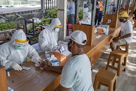 Indonesia seeking its own COVID-19 vaccine amid worry about access