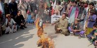 Supporters of Grand Democratic Alliance burn the effigy of Federal Finance Minister Muhammad Ishaq Dar during a protest against inflation in Hyderabad, Pakistan, 31 January 2023. Protesters demanded an end to rising inflation and the government's failure to control the prices of basic products, as government had on 29 January increased fuel prices by 35 Pakistani rupees per liter (0.44 US dollar), bringing the petrol price to 215 Pakistani rupees (0.80  US dollar) per liter.  EPA-EFE/NADEEM KHAWAR 6651