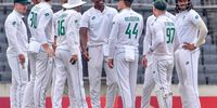 South Africa's Kagiso Rabada (C) celebrates with teammates after taking the wicket of Bangladesh's Nayeem Hasan during the fourth day of the first Test cricket match between Bangladesh and South Africa at the Sher-e-Bangla National Cricket Stadium in Dhaka on October 24, 2024. (Photo by TANVIN TAMIM / AFP)