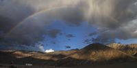 A rainbow appears among dark clouds over the mountains in Zanskar, Kargil district, India, 20 July 2025.  EPA/FAROOQ KHAN