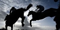 Runners and riders clear a fence in the IEP Financial Handicap Chase at Plumpton Racecourse on March 13, 2023 in Plumpton, England. (Photo by Mike Hewitt/Getty Images)