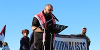 Sharif Mosa, a Palestinian journalist living in South Africa, addresses protesters at the march. (Photo: Tamsin Metelerkamp)