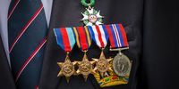 Medals of Royal Navy veteran Charles Medhurst as he stands outside his house on VE Day in Greenwich, London. (Photo: EPA-EFE / Vickie Flores)